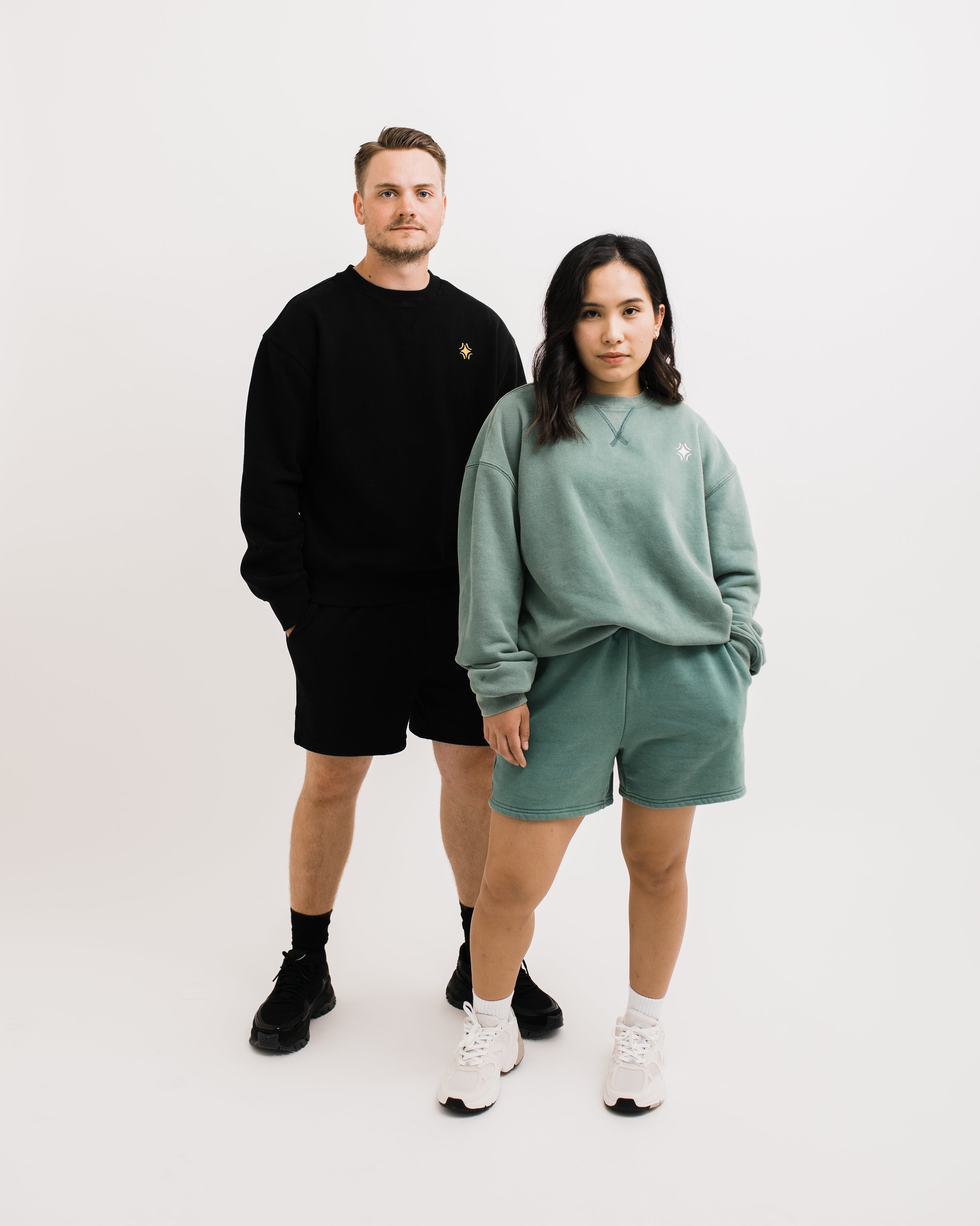 Couple wearing Sojourn Moto Camp Crew crewneck sweatshirt sweatshort set