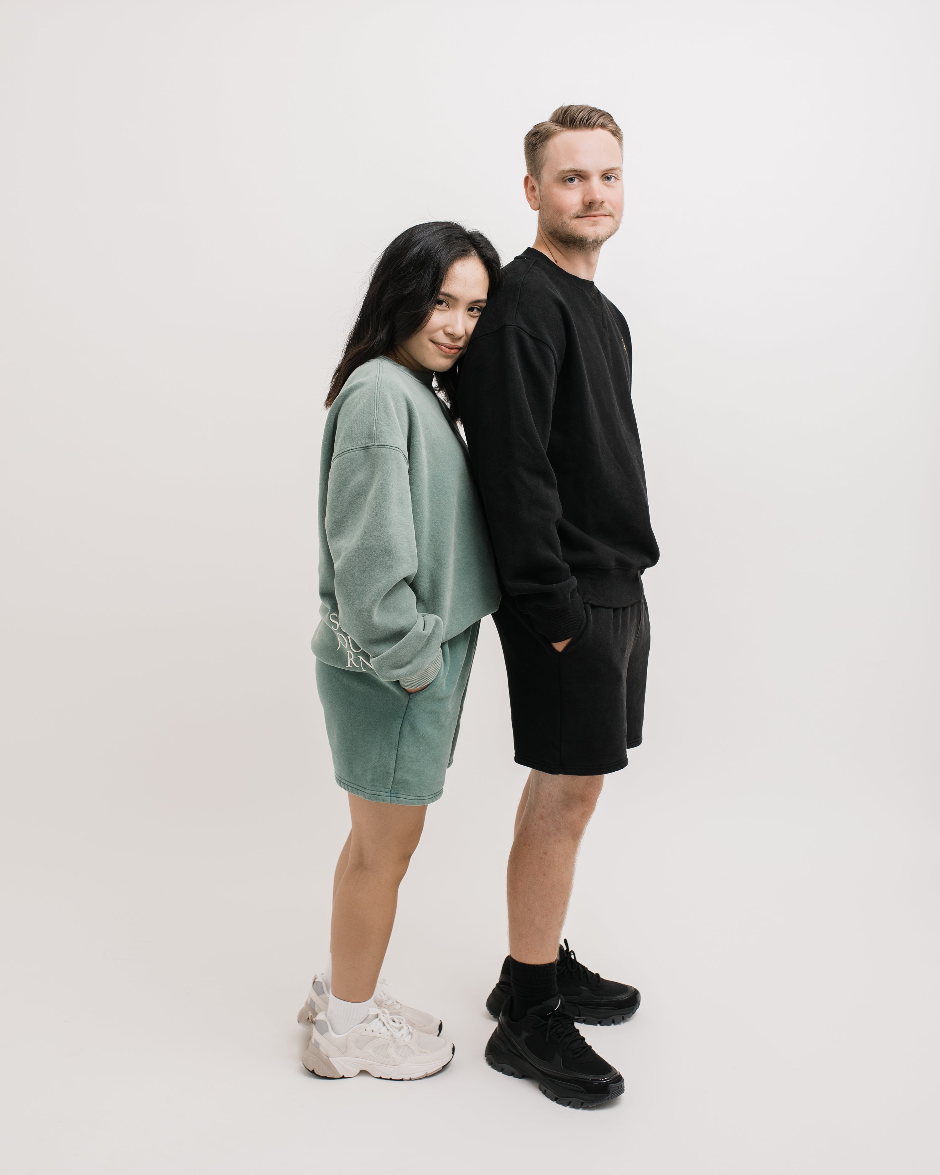 Couple wearing Sojourn Moto Camp Crew crewneck sweatshirt sweatshort set