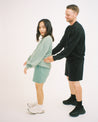 Couple wearing Sojourn Moto Camp Crew crewneck sweatshirt sweatshort set